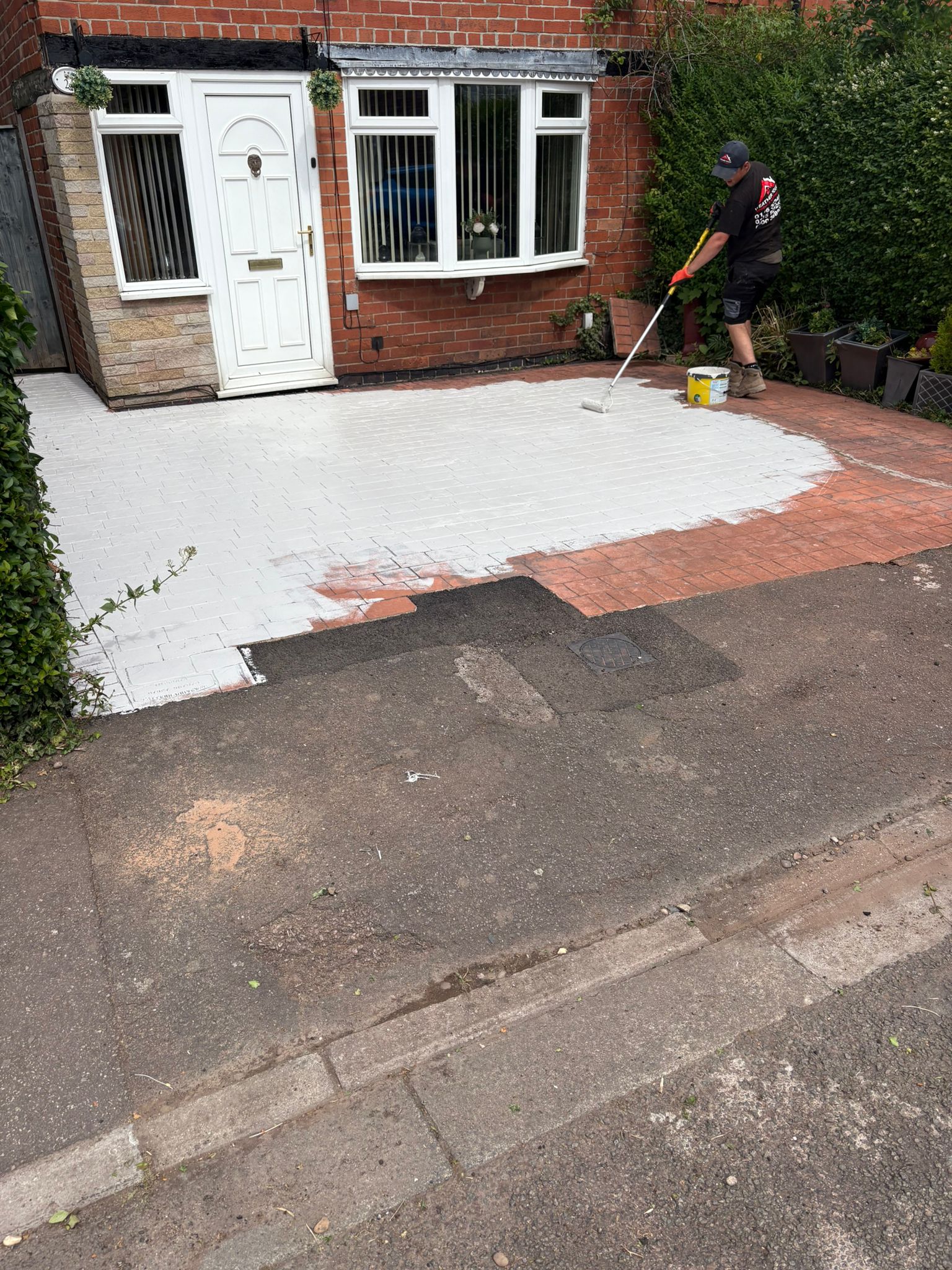Driveway sealing and painting work in progress