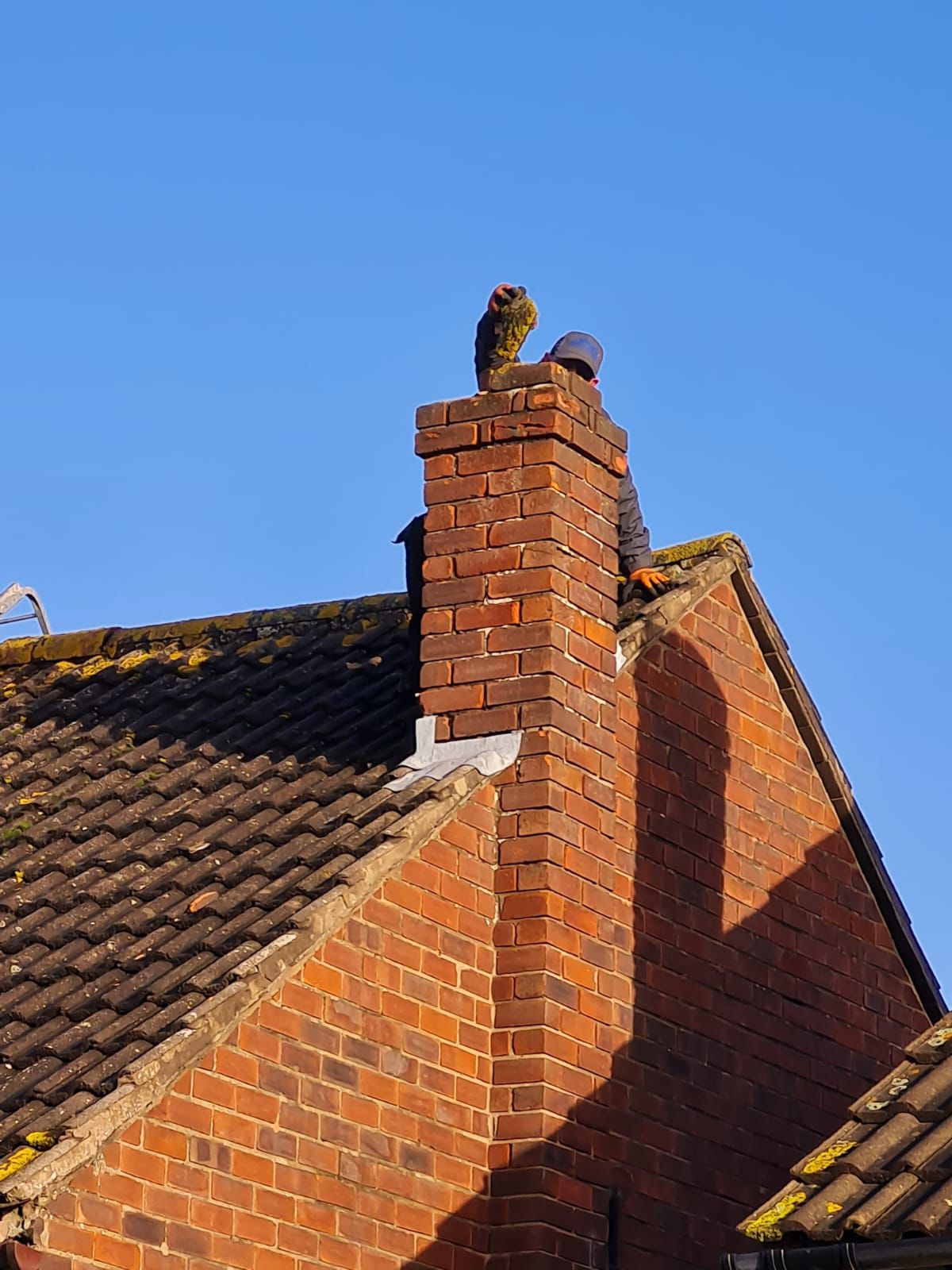 Roofing project showing scaffolding and tile work