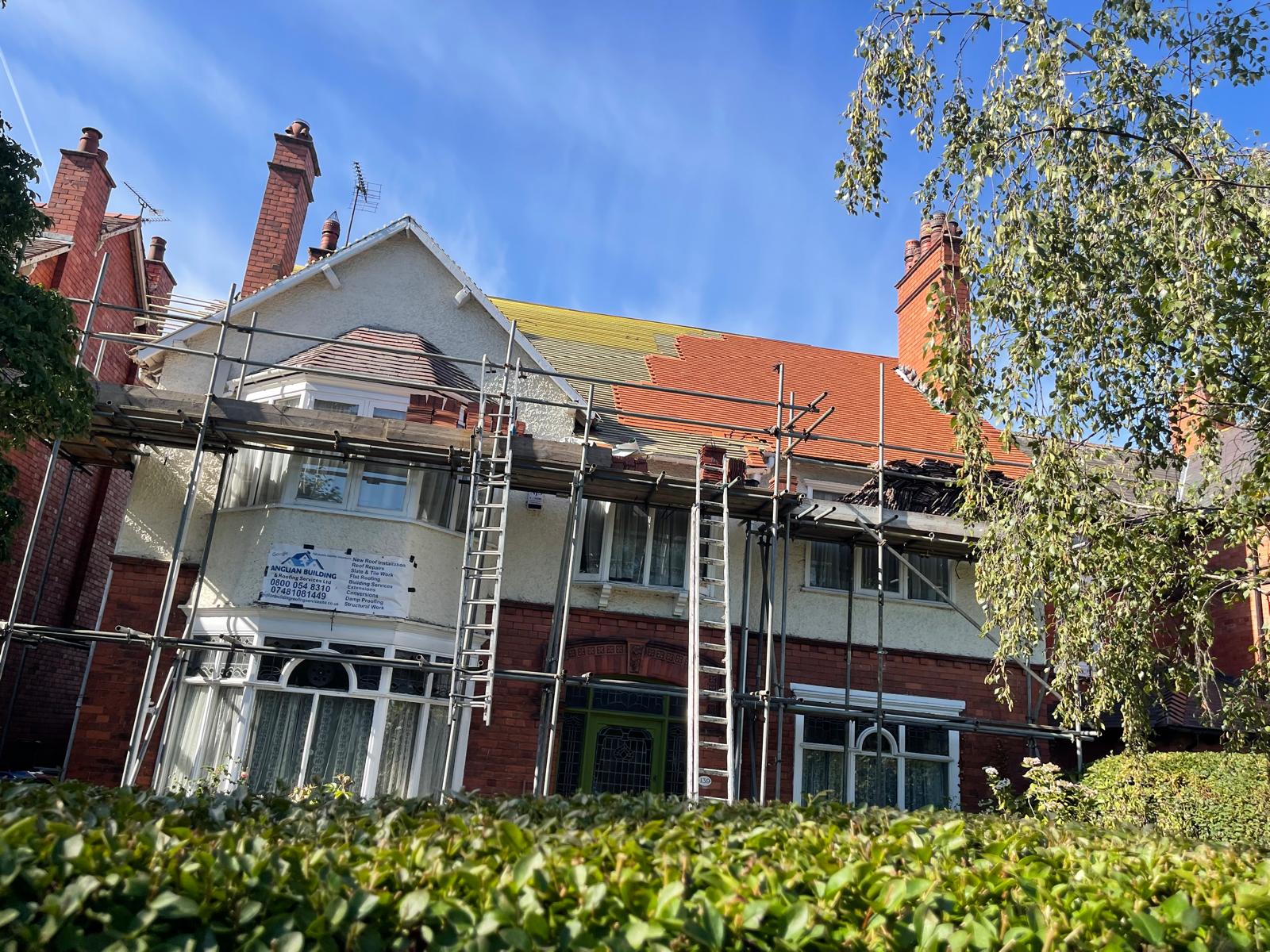 Re-roofing project in progress on a large detached property in London
